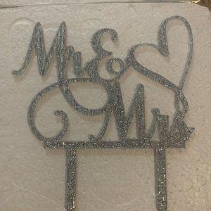 Silver wedding accessories ( cake topper, table numbers, wooden fan, holders)
